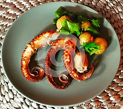 Squid tentacles with potatoes Stock Photo