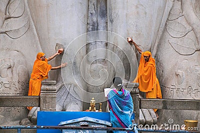SRAVANABELGOLA, KARNATAKA, MAY 2016, Priests offer worship to gigantic statue of Bahubali, Chandragiri hill Editorial Stock Photo