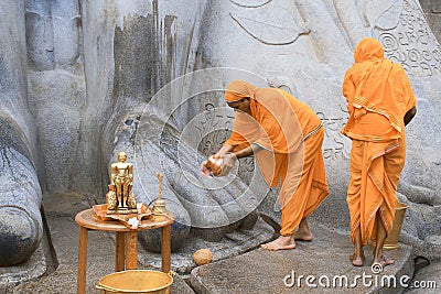 SRAVANABELGOLA, KARNATAKA, MAY 2016, Priests offer worship to gigantic statue of Bahubali, Chandragiri hill Editorial Stock Photo