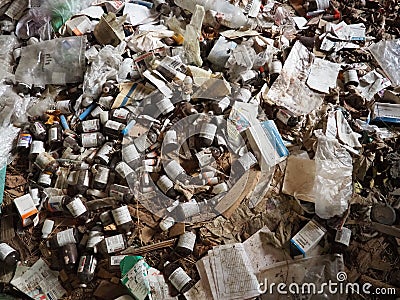 Sremska Mitrovica, Serbia. 07 February 2021, Room with trash in an abandoned house. Packages, paper, plastic items, medicines, Editorial Stock Photo