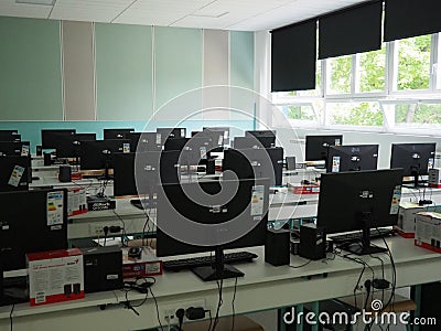 Sremska Mitrovica, Serbia, May 15, 2021 Group of computer neatly placed in a computer lab. Computers, monitors, wires in Editorial Stock Photo