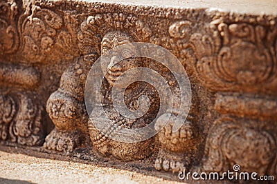 Sri Lanka, Anuradhapura. Mythological character on stone wall of Stock Photo