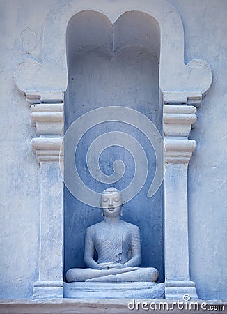 Sri Lanka, Anuradhapura. Old Buddha Statue in Exterior of the Te Stock Photo