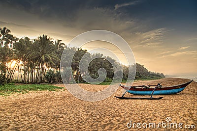 sri Lankan beach with sunrise boat Stock Photo