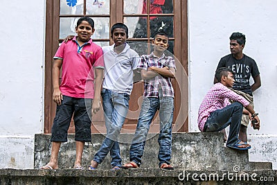 Sri Lankan boys at the Temple of the Sacred Tooth Relic in Kandy, Sri Lanka. Editorial Stock Photo