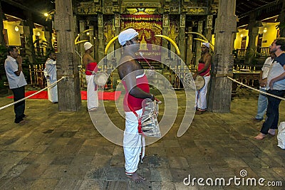 Sri Lankan drummers playing within the Temple of the Sacred Tooth Relic in Kandy, Sri Lanka. Editorial Stock Photo