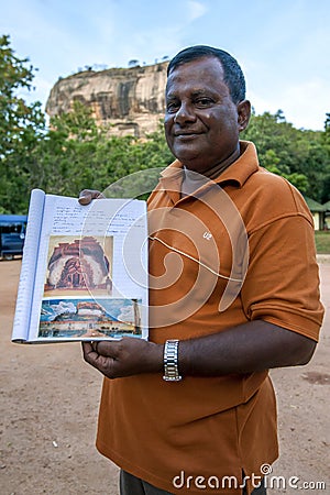 A Sri Lankan tour guide at the base of Sigiriya Rock. Editorial Stock Photo