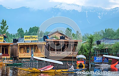 Srinagar, India - April 25, 2017 : Lifestyle in Dal lake, People living in `House boat` and using small boat `Shikara` for Editorial Stock Photo