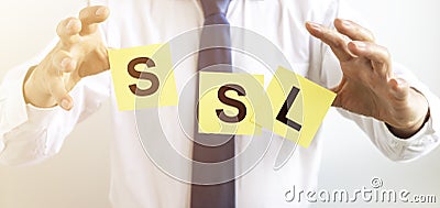 SSL, security certificate for web site written on papers between businessman hands Stock Photo