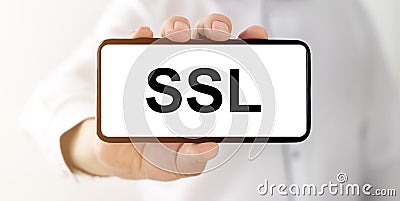 SSL, security certificate for web site written on white phone screen in male hand Stock Photo