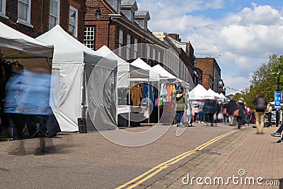 St Albans-UK - 19 May 2021 - People shopping and walking on busy retail high street with market stalls and shops Editorial Stock Photo