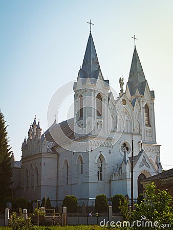 St. Anna Roman Catholic Church facade shine in sun dawn rays, backlit historic Christian temple Editorial Stock Photo