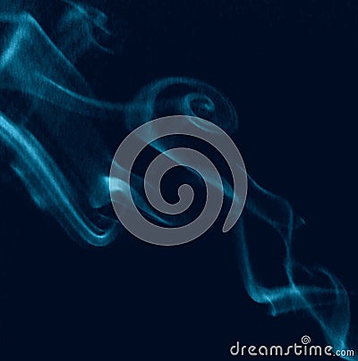 Photograph of blue swirling wispy smoke. Stock Photo