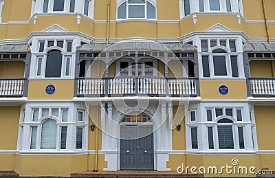 St Aubyns Mansions on Kings Esplanade, Hove, East Sussex, UK. Restored mustard coloured block of flats overlooking the sea Editorial Stock Photo