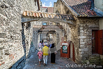 St Catherine`s Passage - a picturesque medieval walkway with stone arches - in Tallinn, Estonia Editorial Stock Photo