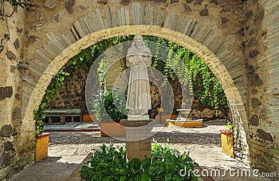 St. Francis of Assisi statue in colonial garden Stock Photo