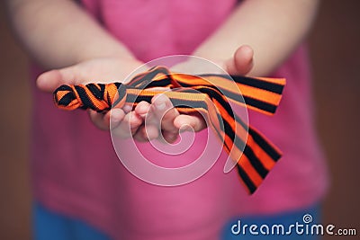 St.George`s Ribbon girl hands Stock Photo