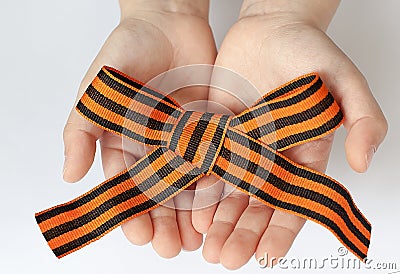 St. George`s ribbon loop isolated on white background. Black and orange ribbon Stock Photo