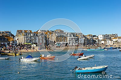 St Ives, harbour with boats and high tide. Popular seaside town and port in Cornwall August 28 2022 Editorial Stock Photo