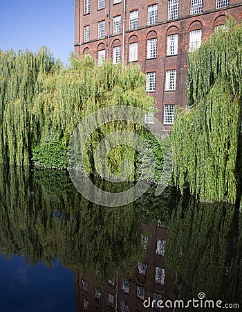 St James Mill and Willow trees along the river. Stock Photo