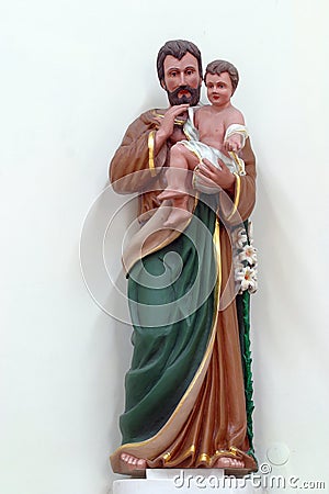 St. Joseph holds a child of Jesus, a statue in the parish church of St. Paul in Retkovec, Zagreb, Croatia Stock Photo