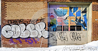 The St. Lawrence Warehouse covered with Graffiti on the wall in Montreal Editorial Stock Photo