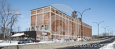 The of St. Lawrence Warehouse with a water tank on the roof in Montreal Editorial Stock Photo