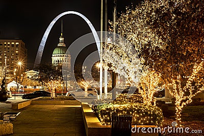 St Louis, Missouri, USA, Dec 2019 - St Louis Gateway Arch and Old Courthouse, and trees light with Christmas lights Editorial Stock Photo