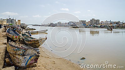 St Louis, Senegal - October 12, 2014: Colorful painted wooden fishing boats or pirogues at coast of St. Louis Stock Photo