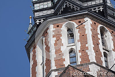 St. Mary`s Basilica Church of Our Lady Assumed into Heaven in Krakow / Cracow, Poland. Trumpeter, bugler playing a bugle call Editorial Stock Photo