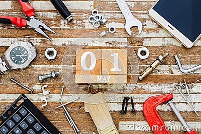 1st May. Happy International Worker's day or Labour Day background concpet. wooden block calendar 1 May and handy tools and Stock Photo