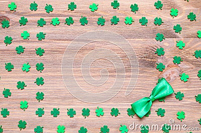 St Patrick`s Day background, green quatrefoils on the wooden background and free space for text Stock Photo