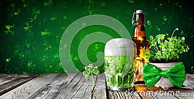 St Patrick`s Day - Green Beer In Glass With Bottle And Clovers Stock Photo