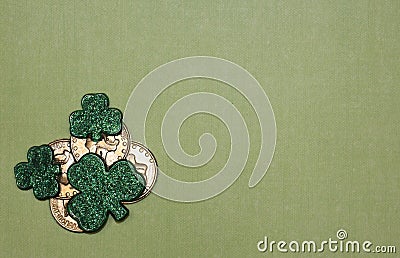 St. Patrick`s Day Luck Themed Flat Lay with Gold Coins and Green Shamrocks on Light Green Background Stock Photo