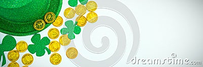 St. Patricks Day leprechaun hat, shamrocks and chocolate gold coins Stock Photo