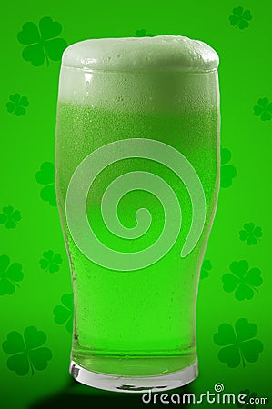 St Patricks day party and Irish celebration of patron saint concept theme with a pint of frothy beer with froth spilling over Stock Photo