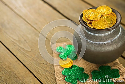 St. Patricks Day shamrock and pot filled with chocolate gold coins Stock Photo