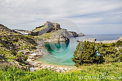 St. Pauls bay, Lindos acropolis in background on Rhodes, Greece Stock Photo