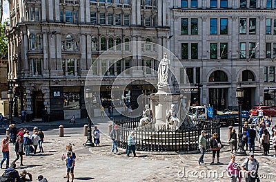 Tourists gathered outside St Pauls Cathedral on sunny day with Victoria Statue Editorial Stock Photo