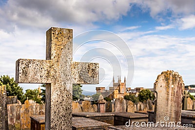 A stone cross and graves at the Candie Cemetery at St Peter Port, Guernsey Editorial Stock Photo