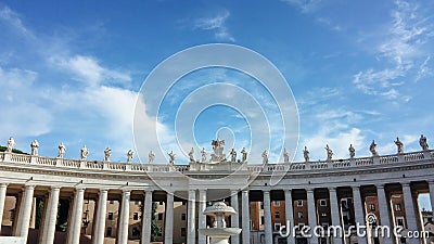 St. Peter`s Square with its statues in Vatican City, Europe. Large plaza located directly in front of St. Peter`s Basilica. Editorial Stock Photo