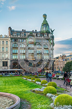 St Petersburg center, Russia. Zinger House on Nevsky Prospect and Kazan square with people walking along Editorial Stock Photo