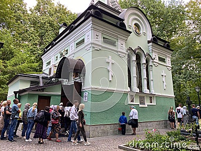 St. Petersburg, Russia, August 2021: The chapel over the grave of Blessed Xenia of St. Petersburg at Smolensk cemetery. A queue of Editorial Stock Photo