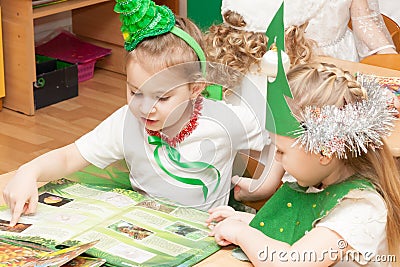 ST. PETERSBURG, RUSSIA - DECEMBER 28: Festively dressed children are engaged in kindergarten,RUSSIA - DECEMBER 28 2016. Editorial Stock Photo