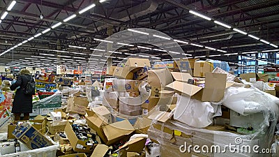 Store. Bankruptcy of supermarket. Retail industry. Clutter trash and scattered goods on dirty floor. Mess. Editorial Stock Photo