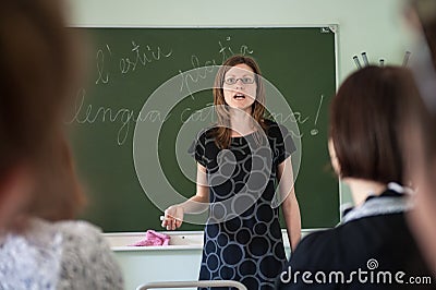 Spanish language lesson at State University. The teacher is a young attractive slender Editorial Stock Photo