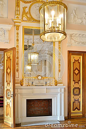 The fireplace, mirror and chandelier in the Marble dining room i Editorial Stock Photo