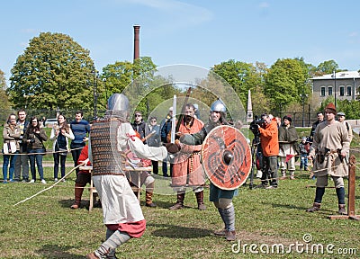 Historical reconstruction of sword fighting. Demonstrative fight with swords in St. Petersb Editorial Stock Photo