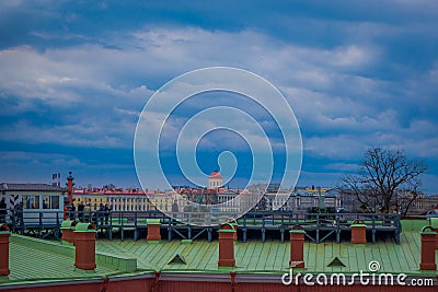 ST. PETERSBURG, RUSSIA, 17 MAY 2018: Outdoor view of unidentified people walking in a green rooftop close to old Editorial Stock Photo