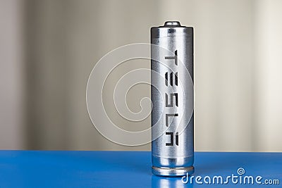 Cylindrical battery with Tesla logo, for a pack of cells. Editorial Stock Photo